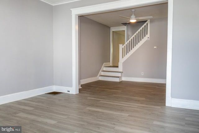 229 New Trent, Ewing, NJ 08638 - spare room with wood finished floors, baseboards, stairs, a ceiling fan, and ornamental molding