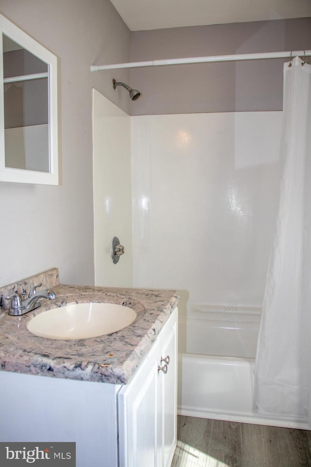 229 New Trent, Ewing, NJ 08638 - bathroom featuring shower / tub combo with curtain, vanity, and wood finished floors