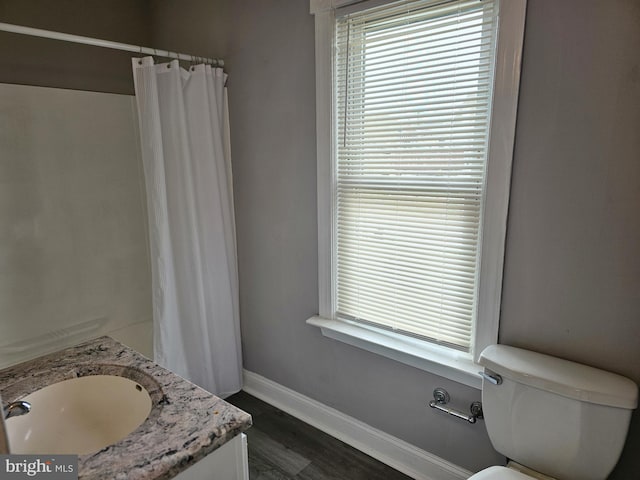 229 New Trent, Ewing, NJ 08638 - full bath with vanity, baseboards, wood finished floors, toilet, and a shower with shower curtain