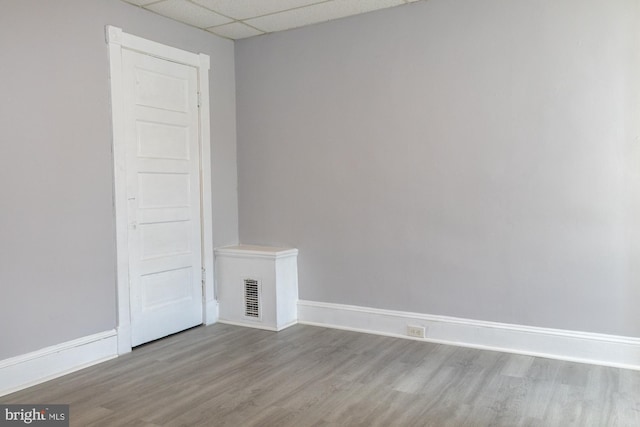 229 New Trent, Ewing, NJ 08638 - empty room with a drop ceiling, wood finished floors, and baseboards