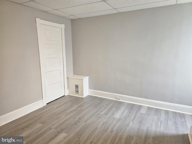 229 New Trent, Ewing, NJ 08638 - unfurnished room featuring a drop ceiling, baseboards, and wood finished floors