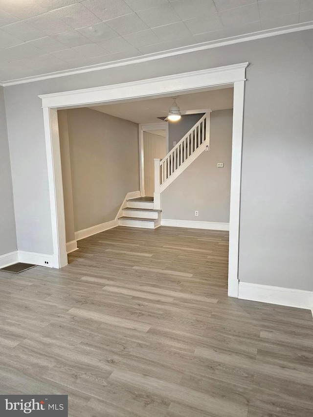 229 New Trent, Ewing, NJ 08638 - spare room with ornamental molding, stairs, baseboards, and wood finished floors