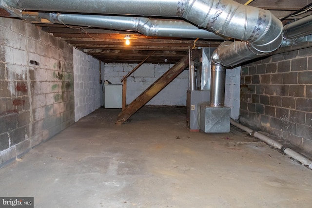 229 New Trent, Ewing, NJ 08638 - unfinished basement with concrete block wall, heating unit, and washer / dryer
