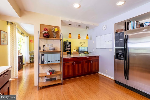 1030 Rock Creek Dr, Wyncote, PA 19095 - kitchen featuring stainless steel fridge, light wood finished floors, light countertops, open shelves, and decorative light fixtures