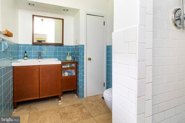1030 Rock Creek Dr, Wyncote, PA 19095 - bathroom with tile walls, vanity, wainscoting, tile patterned flooring, and toilet