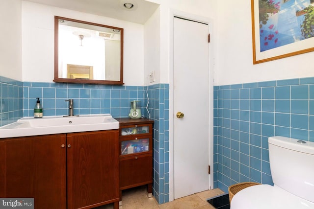 1030 Rock Creek Dr, Wyncote, PA 19095 - bathroom featuring tile walls, a wainscoted wall, vanity, tile patterned floors, and toilet