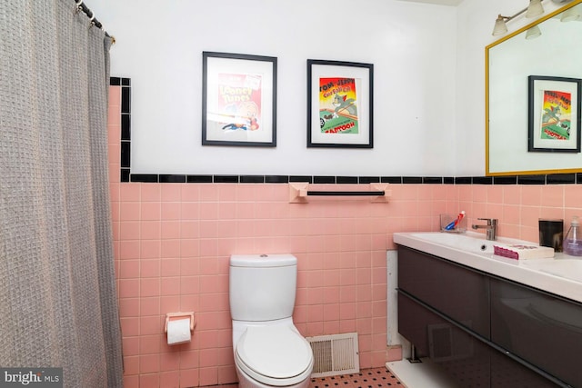 1030 Rock Creek Dr, Wyncote, PA 19095 - bathroom with tile walls, vanity, toilet, a wainscoted wall, and curtained shower