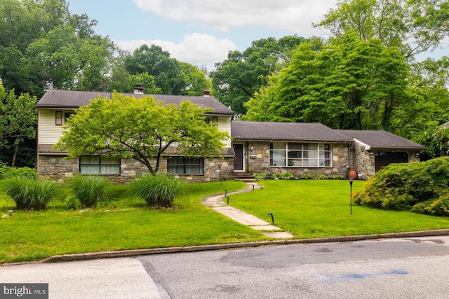 1030 Rock Creek Dr, Wyncote, PA 19095 - tri-level home featuring stone siding, a chimney, and a front yard