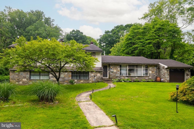 1030 Rock Creek Dr, Wyncote, PA 19095 - tri-level home featuring stone siding, a garage, a front yard, and a chimney