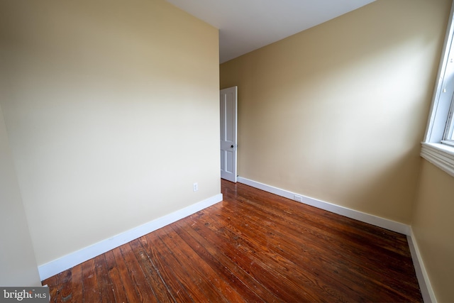 846 W 34th St W, Baltimore, MD 21211 - unfurnished room with baseboards and dark wood finished floors