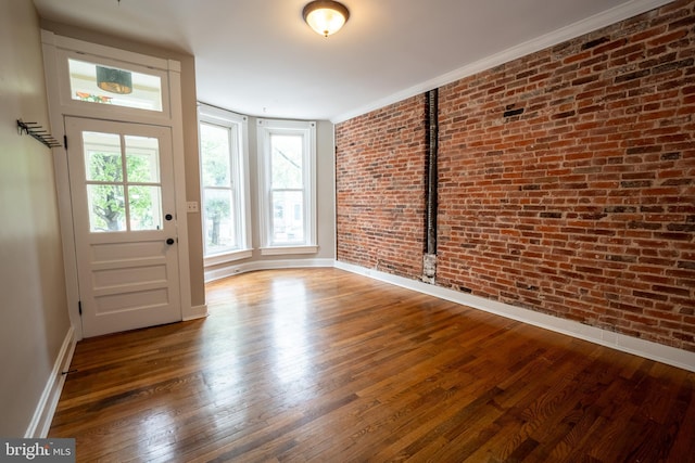 846 W 34th St W, Baltimore, MD 21211 - foyer entrance with brick wall, wood-type flooring, and baseboards