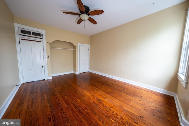 846 W 34th St W, Baltimore, MD 21211 - unfurnished bedroom featuring wood finished floors, a closet, baseboards, and a ceiling fan