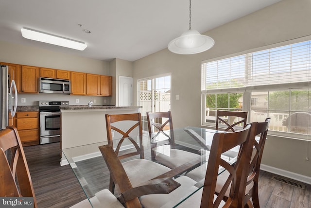 5059 Ottawa Park Pl, Waldorf, MD 20602 - dining room featuring dark wood-style floors and baseboards