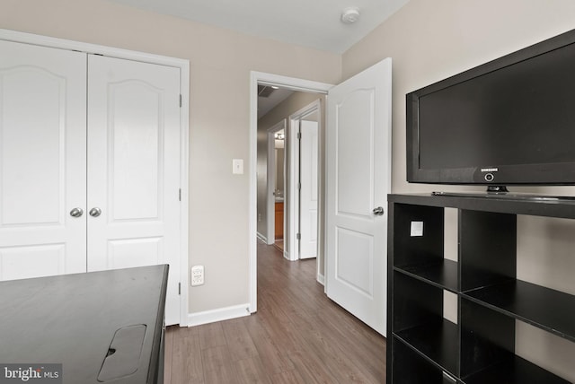 5059 Ottawa Park Pl, Waldorf, MD 20602 - unfurnished bedroom with wood finished floors, baseboards, and a closet