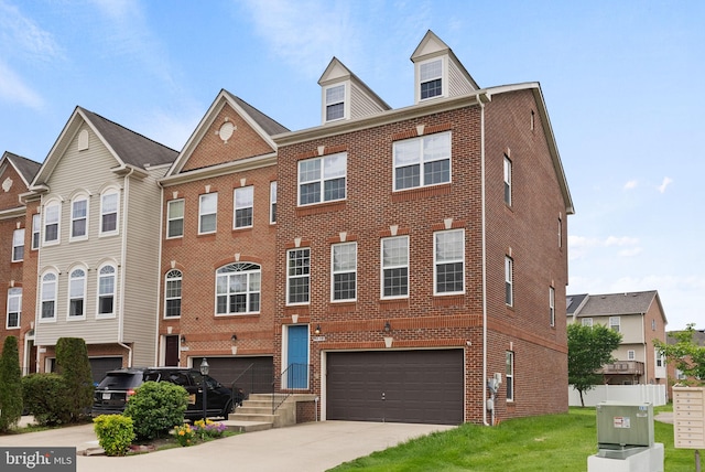 5059 Ottawa Park Pl, Waldorf, MD 20602 - townhome / multi-family property with brick siding, a garage, and concrete driveway