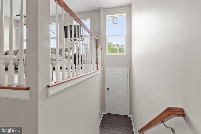 5059 Ottawa Park Pl, Waldorf, MD 20602 - stairway featuring wood finished floors, baseboards, and a chandelier