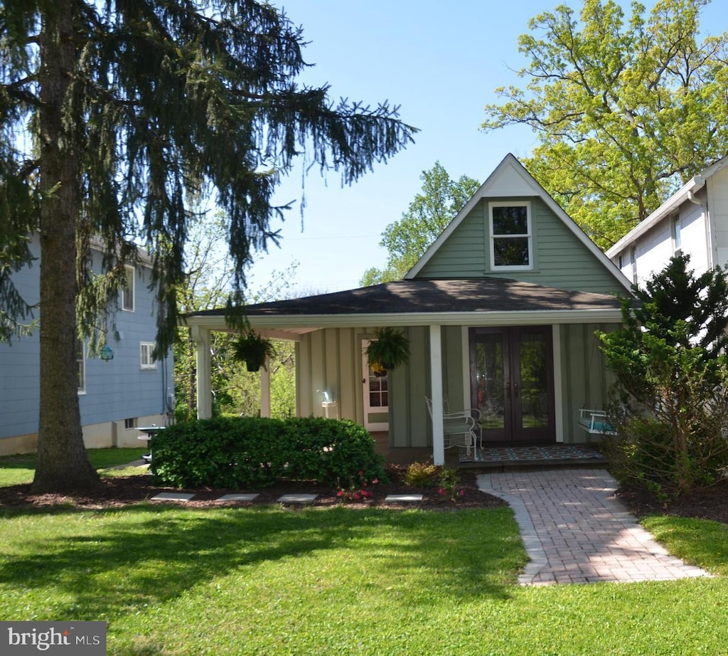 6 Fiske Ave, Glyndon, MD 21136 - view of front of property featuring french doors, board and batten siding, and a front lawn