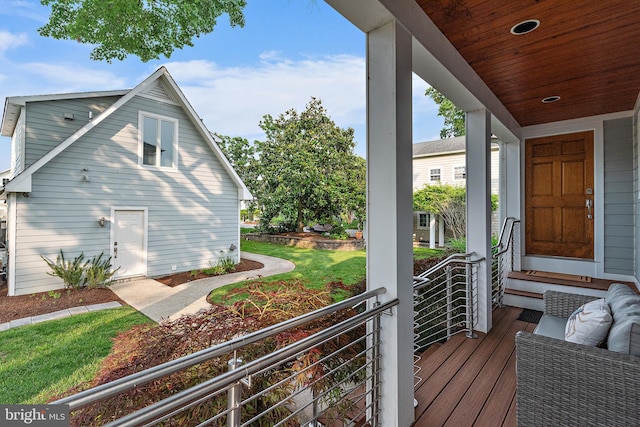 22 E Lake Dr, Annapolis, MD 21403 - wooden deck featuring a lawn