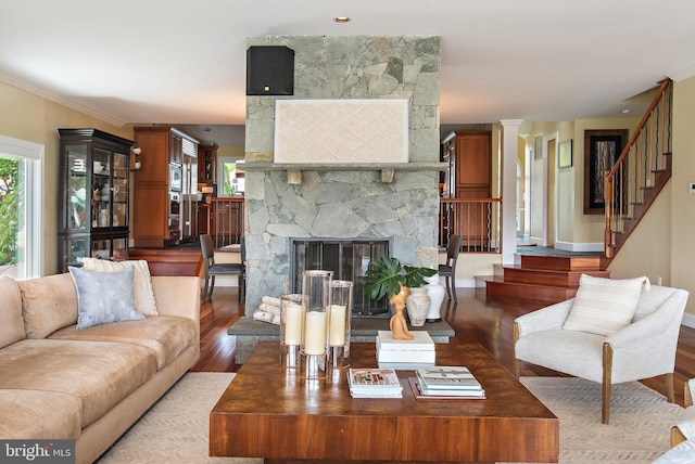 22 E Lake Dr, Annapolis, MD 21403 - living area featuring stairs, wood finished floors, baseboards, and a stone fireplace