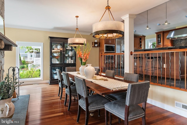 22 E Lake Dr, Annapolis, MD 21403 - dining area featuring wood finished floors, ornamental molding, and baseboards