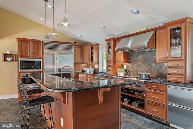 22 E Lake Dr, Annapolis, MD 21403 - kitchen featuring wall chimney exhaust hood, built in appliances, brown cabinetry, lofted ceiling, and recessed lighting