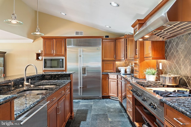 22 E Lake Dr, Annapolis, MD 21403 - kitchen featuring built in appliances, wall chimney range hood, a sink, vaulted ceiling, and brown cabinetry