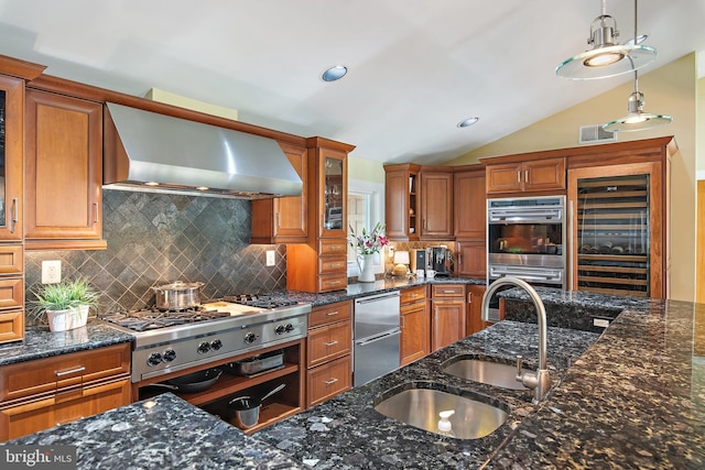22 E Lake Dr, Annapolis, MD 21403 - kitchen featuring appliances with stainless steel finishes, beverage cooler, wall chimney range hood, brown cabinets, and vaulted ceiling
