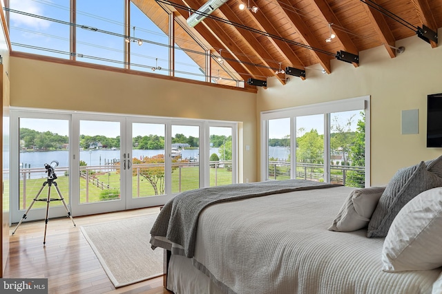 22 E Lake Dr, Annapolis, MD 21403 - bedroom featuring wooden ceiling with exposed beams, high vaulted ceiling, access to exterior, wood-type flooring, and a water view