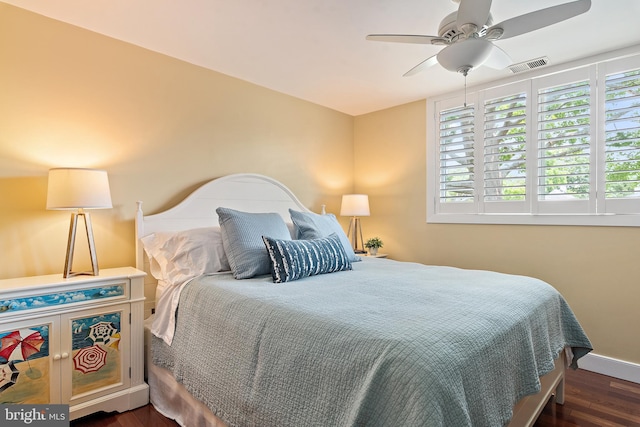22 E Lake Dr, Annapolis, MD 21403 - bedroom with dark wood-style floors, multiple windows, baseboards, and a ceiling fan