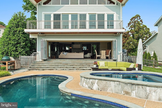 22 E Lake Dr, Annapolis, MD 21403 - rear view of property featuring a balcony and an outdoor pool