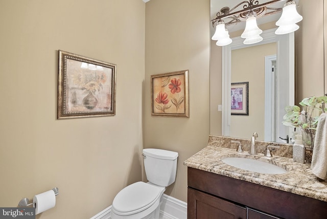 22701 Creighton Farms Dr, Leesburg, VA 20175 - half bathroom with vanity, toilet, and baseboards