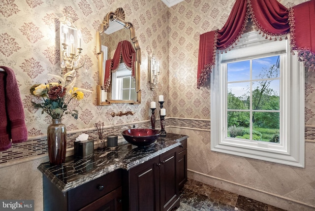 22701 Creighton Farms Dr, Leesburg, VA 20175 - bathroom with vanity, wainscoting, and tile walls