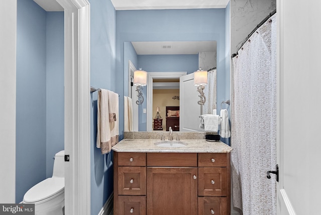 22701 Creighton Farms Dr, Leesburg, VA 20175 - bathroom featuring toilet, vanity, and baseboards