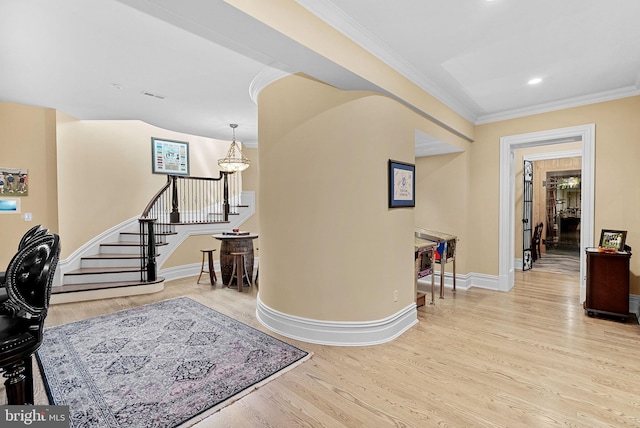 22701 Creighton Farms Dr, Leesburg, VA 20175 - foyer entrance featuring wood finished floors, a chandelier, crown molding, stairway, and baseboards