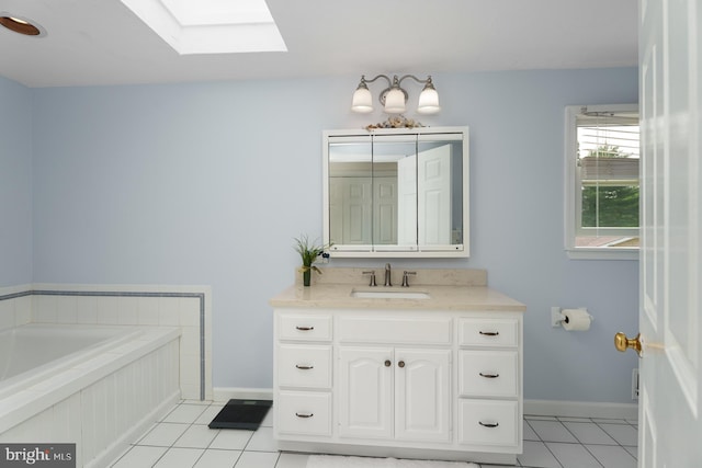 100 Weldon Way, Pennington, NJ 08534 - bathroom featuring a skylight, tile patterned floors, a bath, vanity, and baseboards