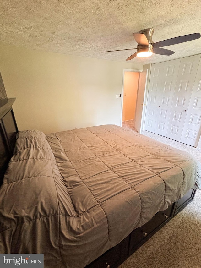 8017 Cipher Row, Jessup, MD 20794 - bedroom featuring a textured ceiling, carpet floors, a ceiling fan, and a closet