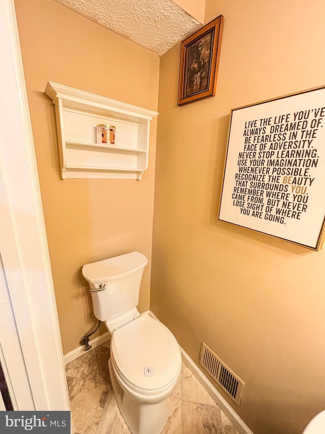 8017 Cipher Row, Jessup, MD 20794 - bathroom featuring a textured ceiling and marble look tile flooring