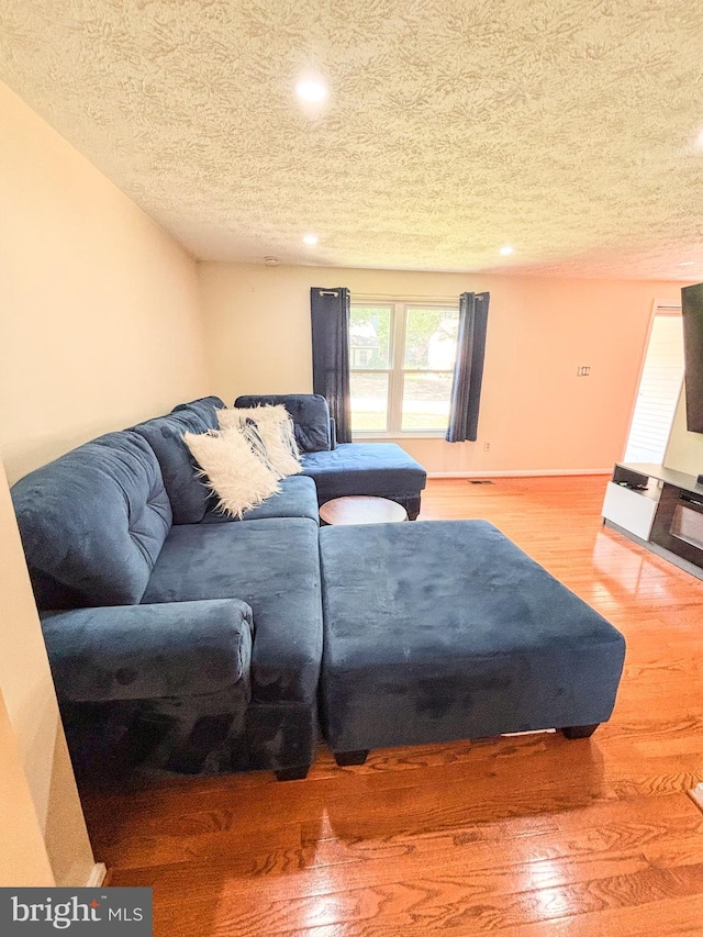 8017 Cipher Row, Jessup, MD 20794 - living area with a textured ceiling, wood finished floors, and recessed lighting