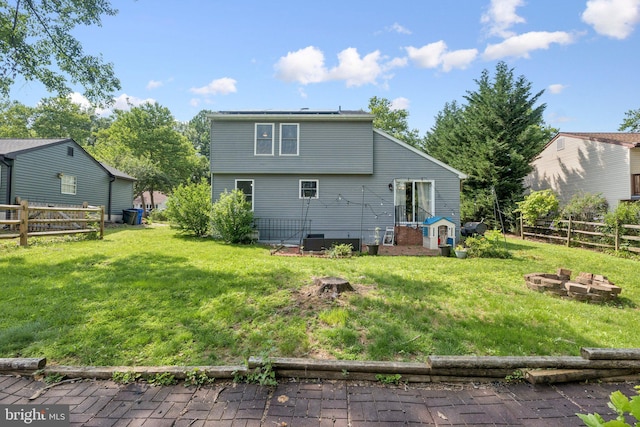 8017 Cipher Row, Jessup, MD 20794 - back of property featuring an outdoor fire pit and a fenced backyard