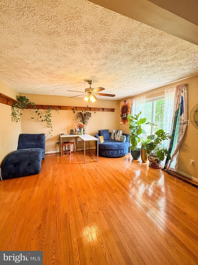 8017 Cipher Row, Jessup, MD 20794 - living room with ceiling fan, wood finished floors, and a textured ceiling