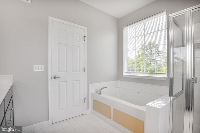 43415 Madison Renee Ter Unit 120, Ashburn, VA 20147 - full bath with a bath, tile patterned flooring, vanity, a stall shower, and baseboards