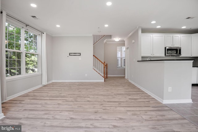 43415 Madison Renee Ter Unit 120, Ashburn, VA 20147 - kitchen featuring stainless steel microwave, white cabinets, recessed lighting, dark countertops, and baseboards