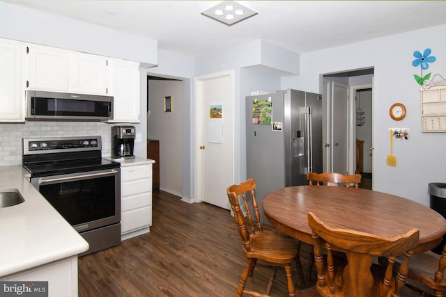 36 Covington Dr, Sicklerville, NJ 08081 - kitchen featuring stainless steel appliances, light countertops, decorative backsplash, white cabinetry, and dark wood finished floors
