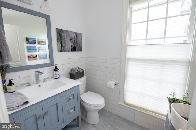 32 Eagleton Farm Rd, Newtown, PA 18940 - half bath with vanity, tile walls, toilet, and tile patterned floors