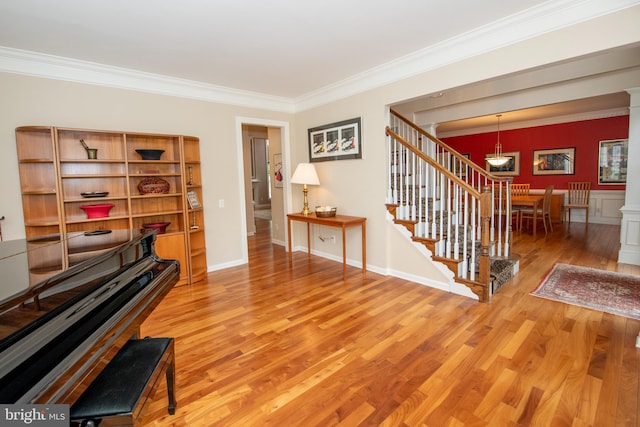 32 Eagleton Farm Rd, Newtown, PA 18940 - living area with ornamental molding, wood finished floors, and stairway