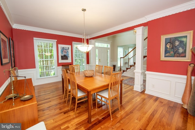 32 Eagleton Farm Rd, Newtown, PA 18940 - dining room with a decorative wall, light wood-style floors, ornamental molding, a wainscoted wall, and stairway