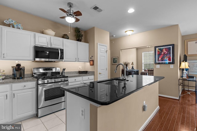 4208 Knox Ct Unit 4208, Warwick, PA 18974 - kitchen featuring stainless steel appliances, a sink, a ceiling fan, white cabinets, and an island with sink