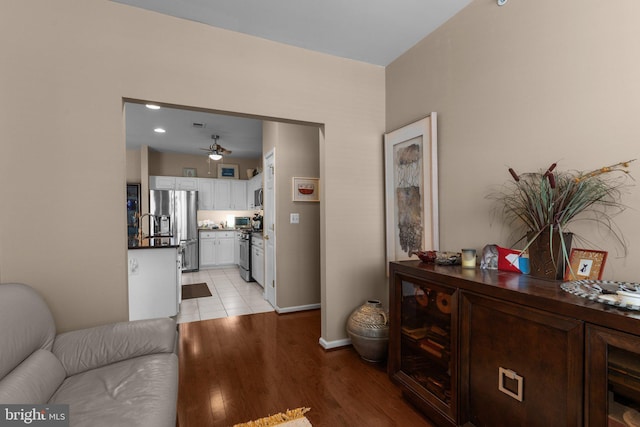 4208 Knox Ct Unit 4208, Warwick, PA 18974 - living area with ceiling fan, wine cooler, light wood-style flooring, and baseboards