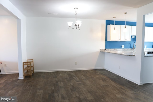 1000 Country Club Rd Unit 8, York, PA 17403 - unfurnished dining area featuring dark wood-type flooring, a chandelier, baseboards, and a sink