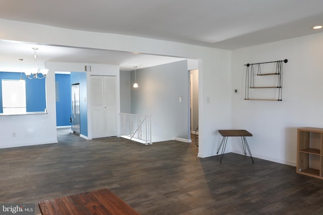 1000 Country Club Rd Unit 8, York, PA 17403 - spare room with a chandelier, dark wood-style floors, and baseboards